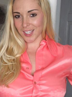 Blonde Secretary Post Tied in Pink Blouse