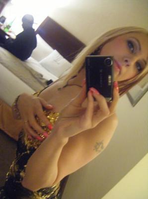 Young sexy blonde amateur taking pictures of herself