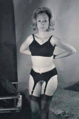 Vintage blonde disrobing