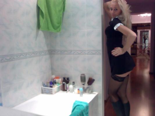 Paris Hilton lookalike stripping in bathroom