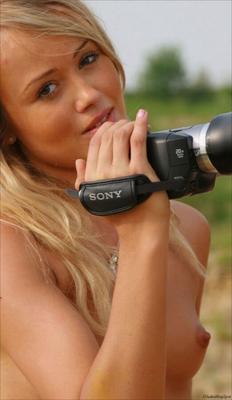 World Models-Nude teen outdoors with camera