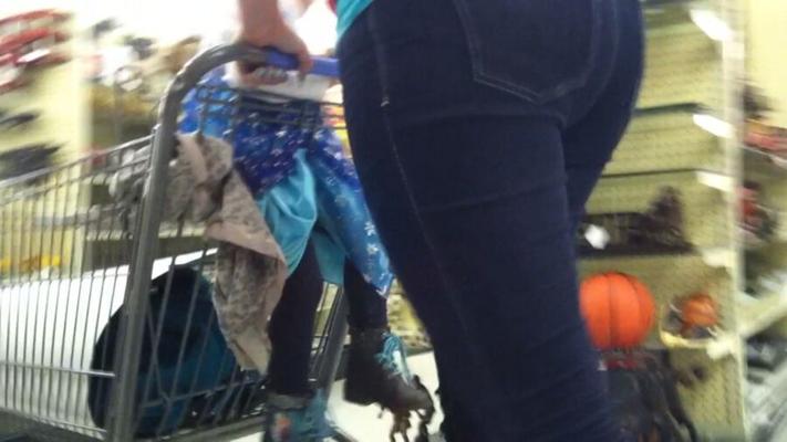 Milf in boots and blue jeans candid